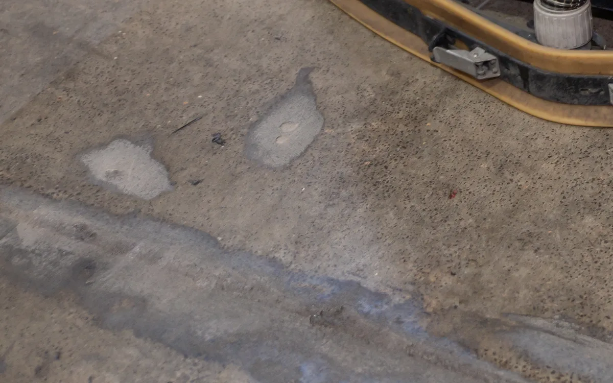 Grimy warehouse concrete floor before cleaning